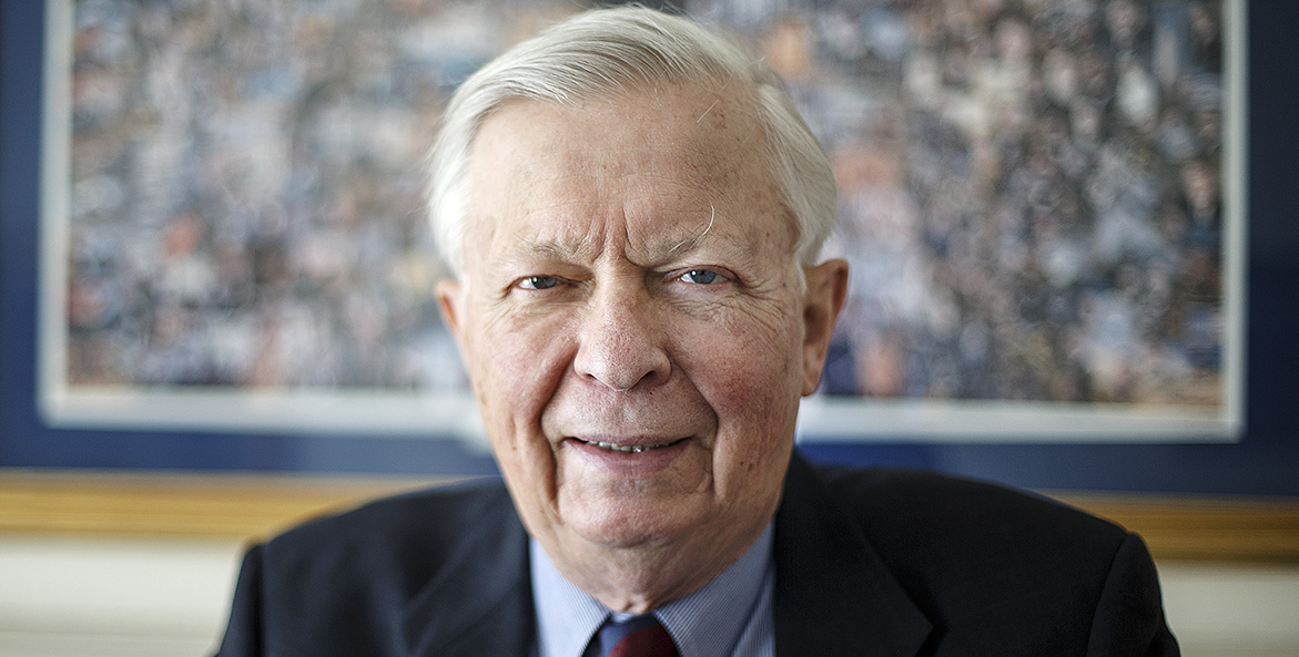 Business portrait of a man in a jacket and tie.