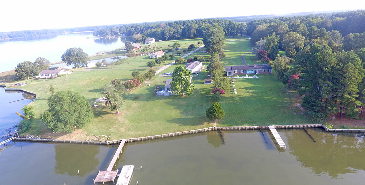 Ariel view of land and water on a sunny day.