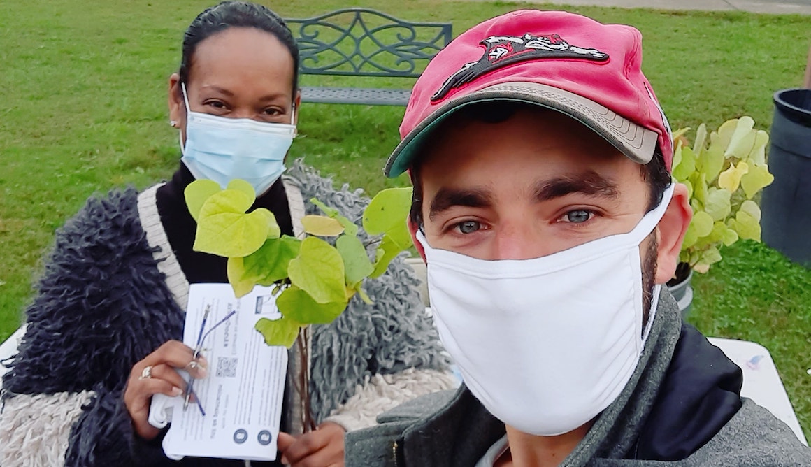 A man and a woman wearing face masks.