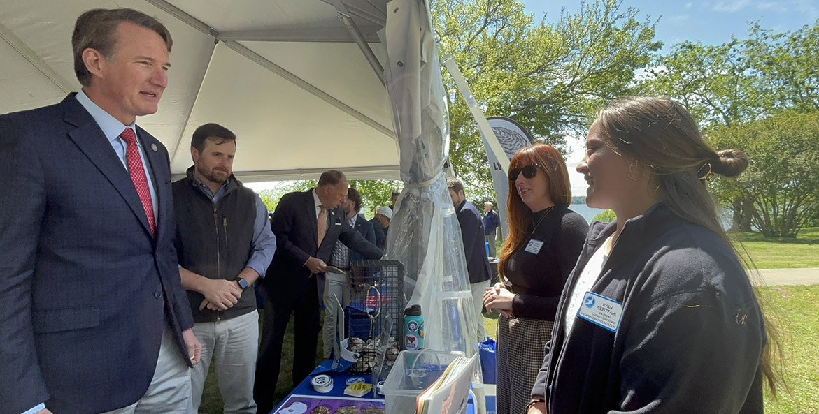 Gov. Youngkin talks with CBF staff by the York River