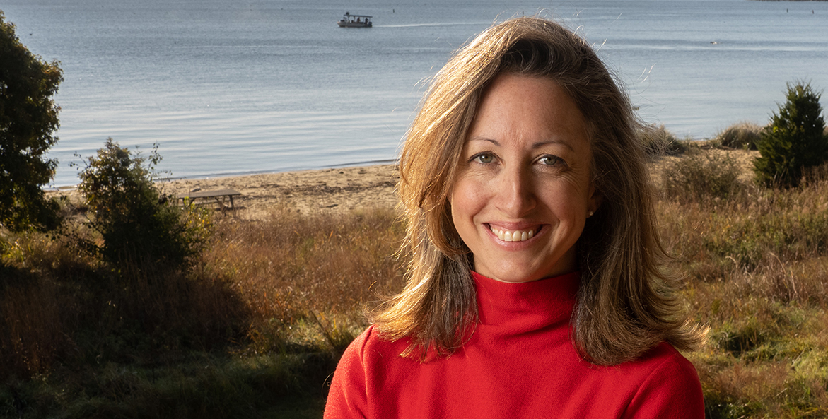 Hilary Harp Falk at CBF headquarters with the Bay in the background.