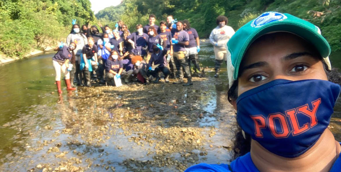 selfie of a woman with students in the background