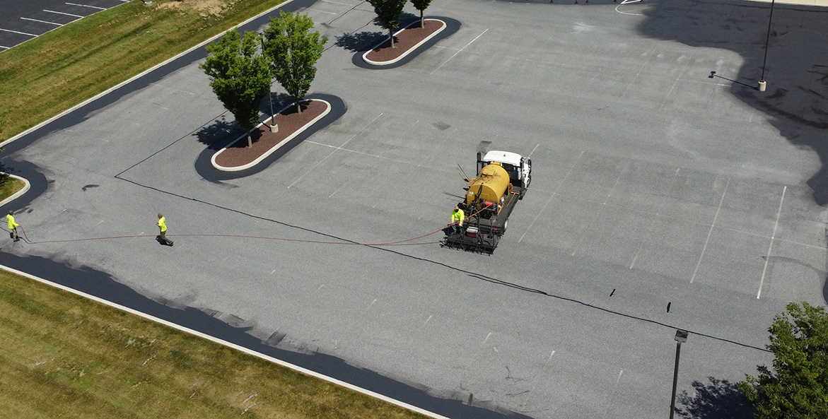 An aerial view of a truck in a parking lot