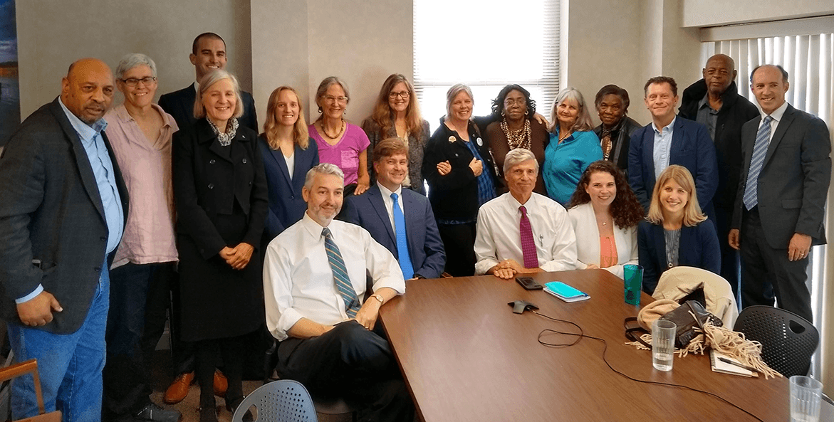 More than a dozen community and legal team members gather to discuss the compressor station challenge.