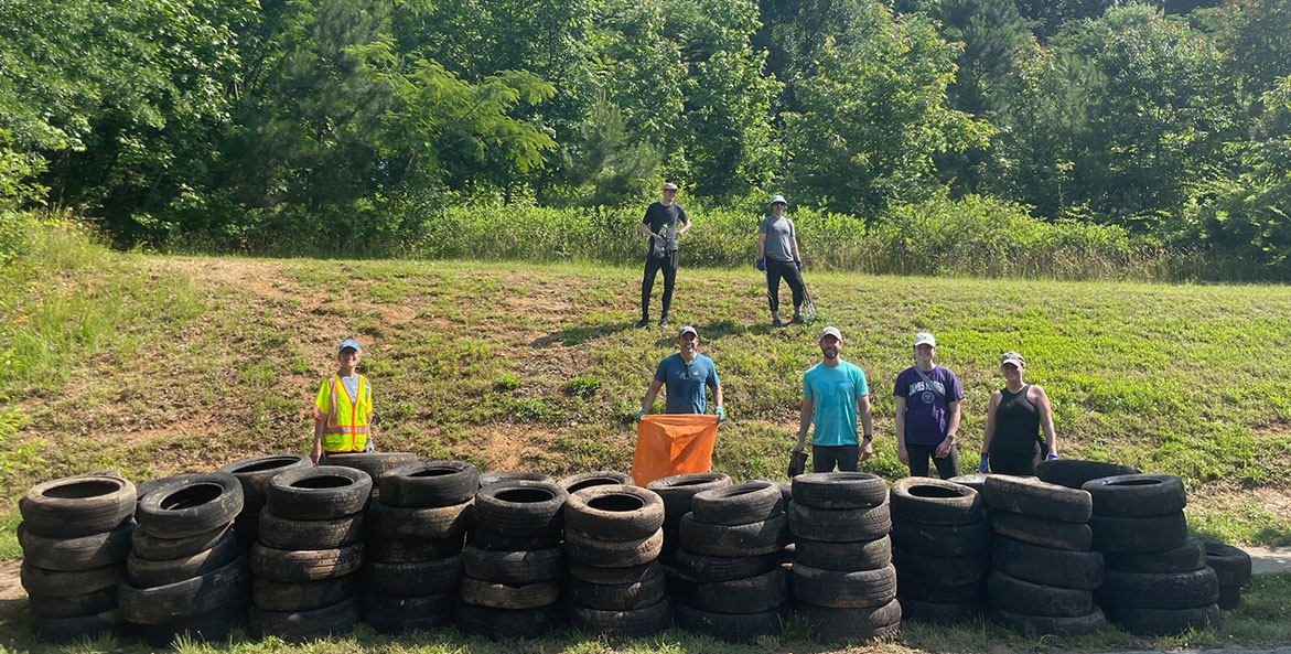 Volunteers with tires at 23 CTBD - Patrick Fanning-CBF Staff - 1171x593 - no caption