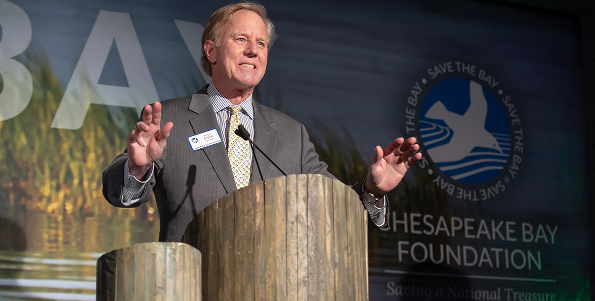 Man speaking at a podium.