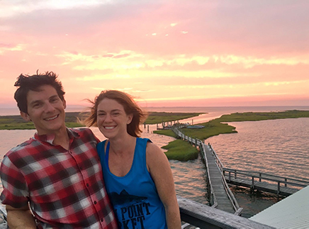 Man and woman at sunset on the islands in middle of Chesapeake Bay.