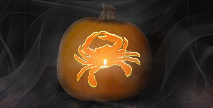 A Jack O'Lantern with a blue crab carved out of it.