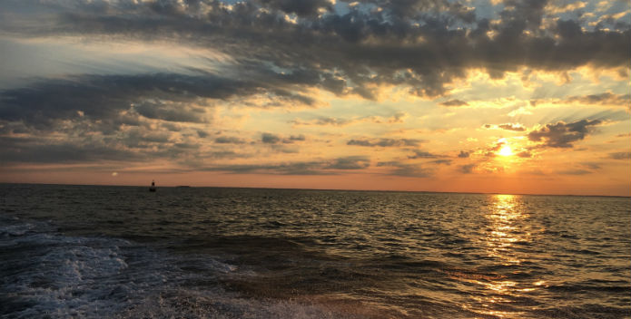 Image of the a summer solstice sunset on the Bay.