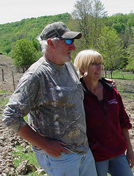 Photo of Terry and Patti Bennet on their farm in Montrose, PA.