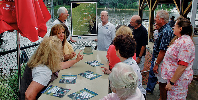 Volunteers speak to audience about Bay issues.