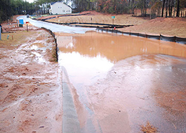 Photo: Mud fills the street along a construction site.