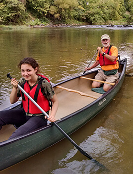 Doug DeGood and his grandaughter canoeing on the Rivanna River.