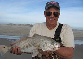 John Bello, a member of CBF's Anglers for Clean Water, shows off one of his catches. 