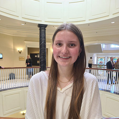 Young girl standing in the atrium of a building