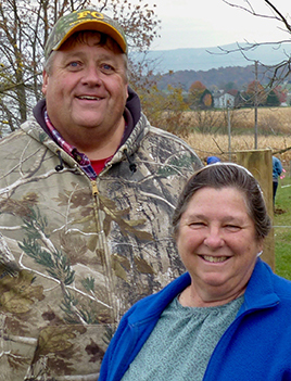 Portrait photo of Glen and Arlene Reid on thier farm in the Linville Creek Watershed.