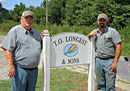 A photo of Thomas Longest and Kevin Norman on their farm