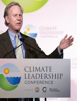 Will Baker speaks from a podium bearing the Climate Leadership Conference logo.