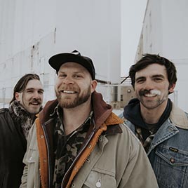 Close-up of three band members.