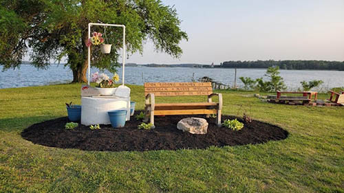 A well in front of a river. 