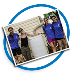 Students with rain barrel. Photo credit CBF Staff.