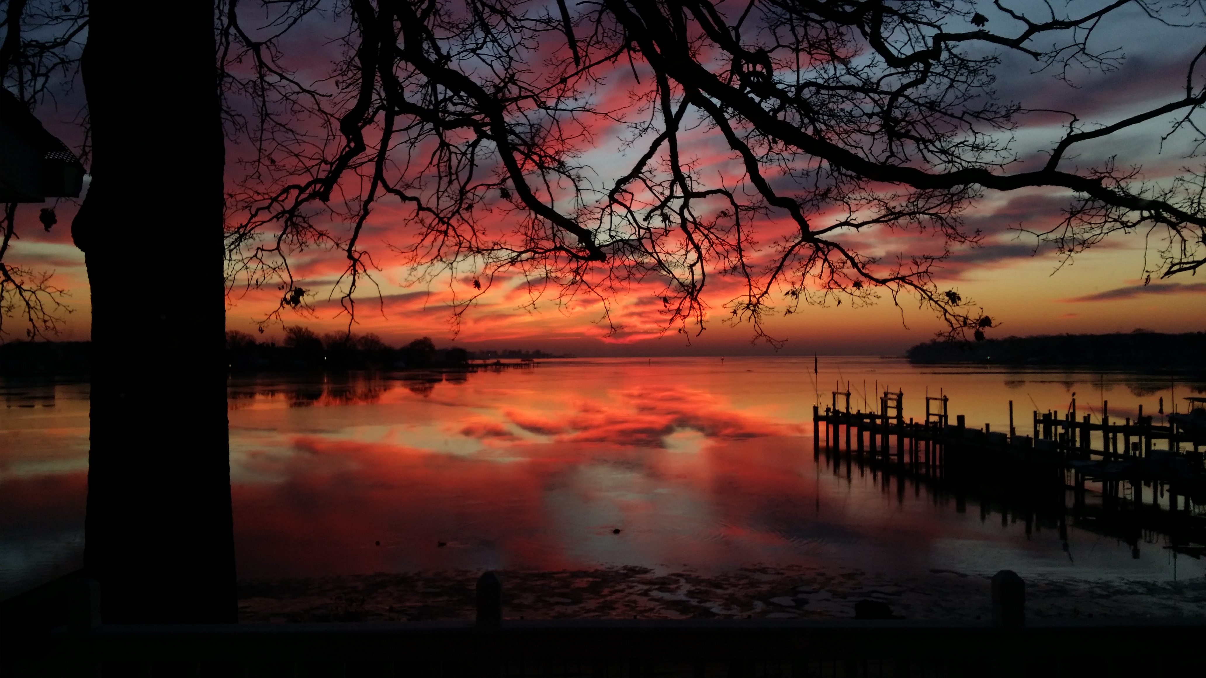 Pink light inching its way across horizon at daybreak along the Middle River. 