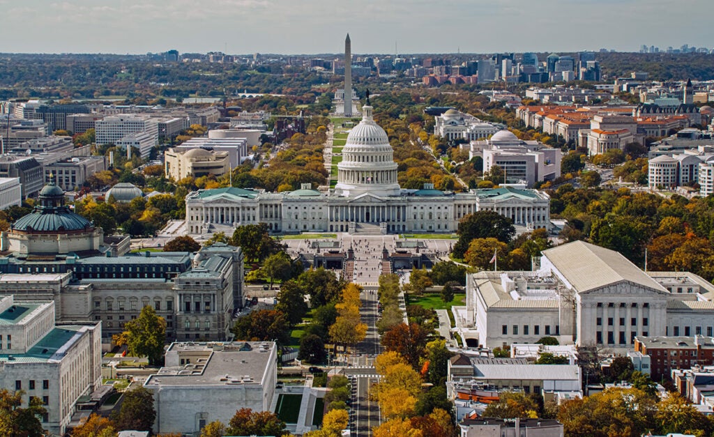 An aerial photo of Washington, D.C. showing the Capitol and the Washington Monument.