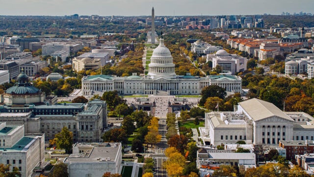 An aerial photo of Washington, D.C. showing the Capitol and the Washington Monument.