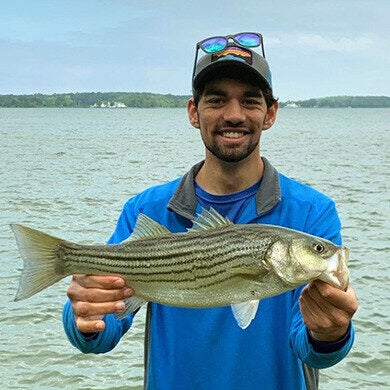 Quinn Lipetz holds a rockfish.