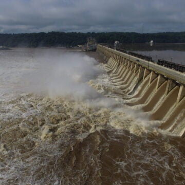 A torrent of muddy water pours from the Conowingo Dam.