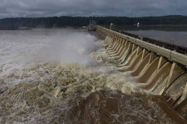 A torrent of muddy water pours from the Conowingo Dam.