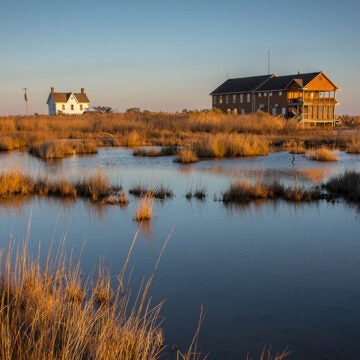 The Karen Noonan Environmental Education Center sits amid marsh grasses.