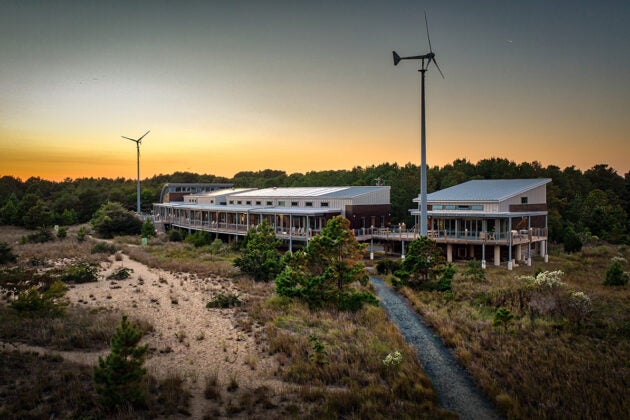 The Brock Environmental Center showing the main building, the classroom, and two wind turbines.