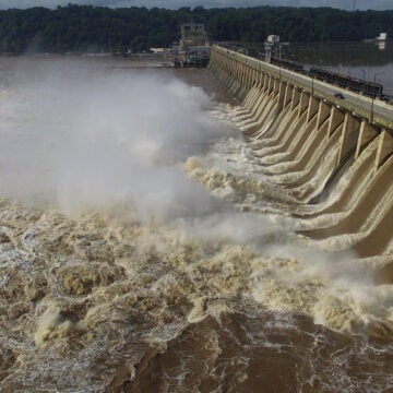 The Conowingo Dam with flood gates open and water rushing through