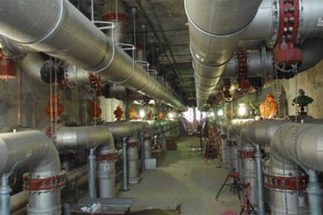 Pipes run underneath a wastewater treatment plant.